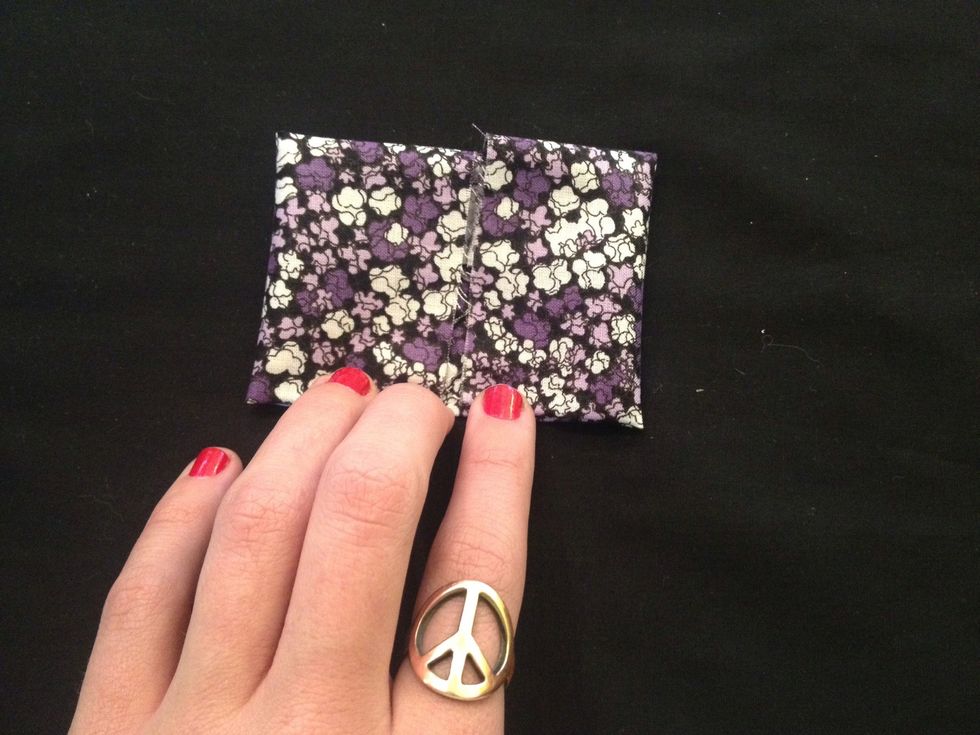 I recommend overlapping one side of the fabric over the other to make the next step easier.