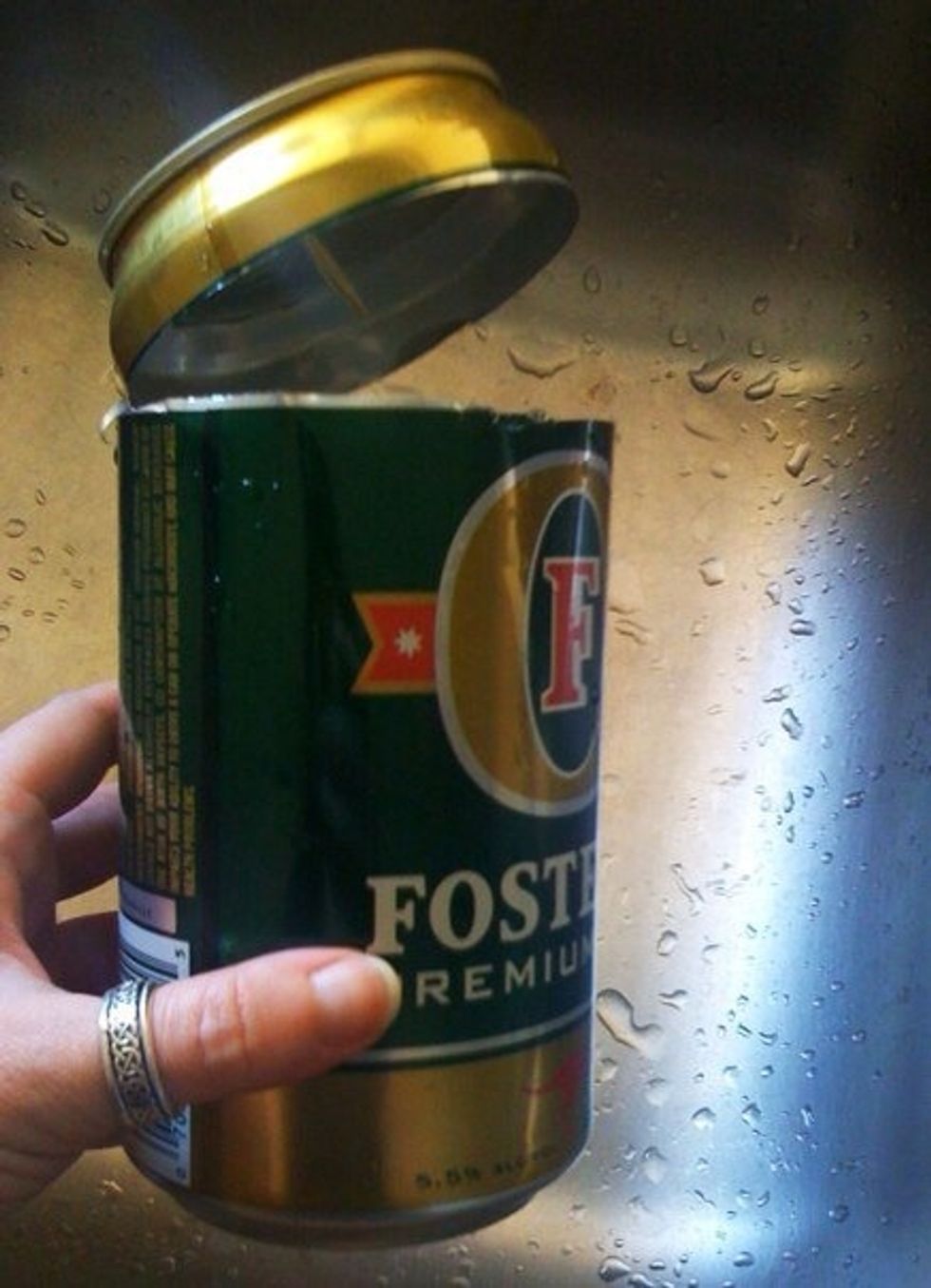 I recommend wearing some gloves during this project to keep from slicing yourself. Also, adult supervision is required! Begin by cutting top off of desired can.