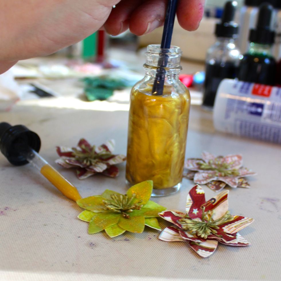 I removed the dropper from the bottle. Put my brush in the Minx and stirred well. Then I painted the Minx onto the flowers.