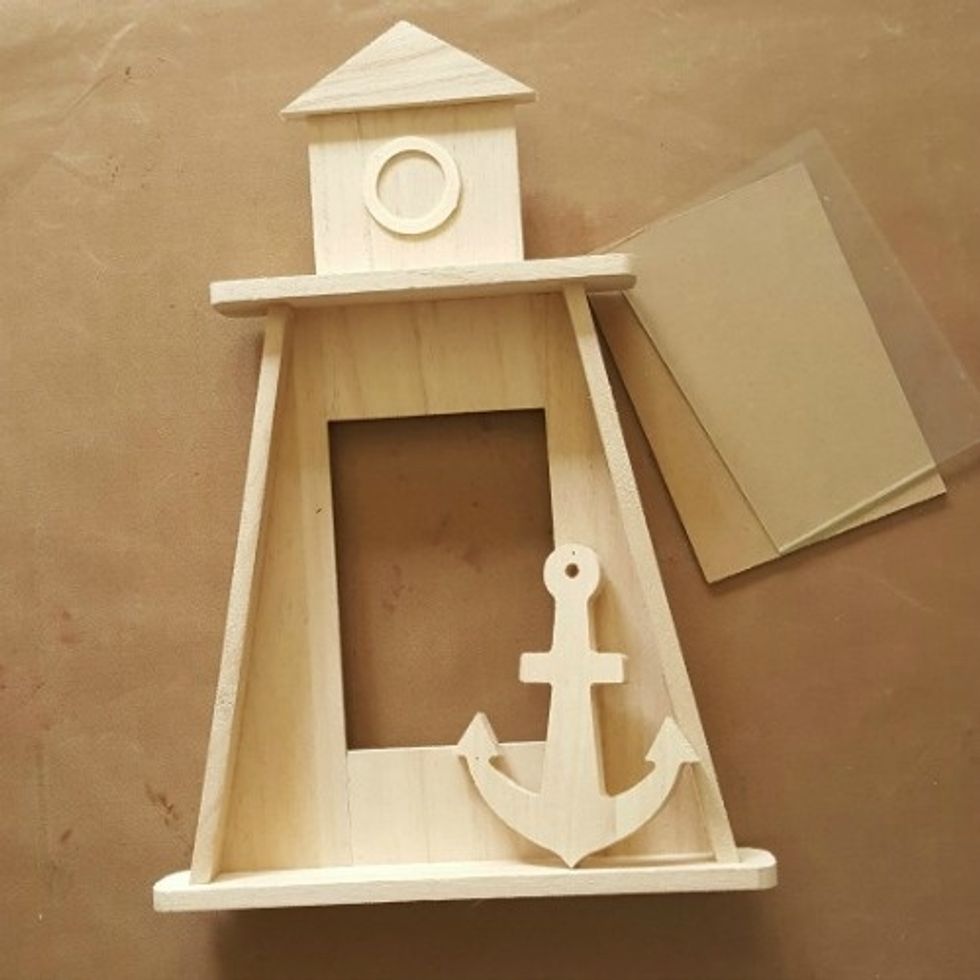 I removed the glass from the Lighthouse Frame. I can later replace it with a photo if I choose to.