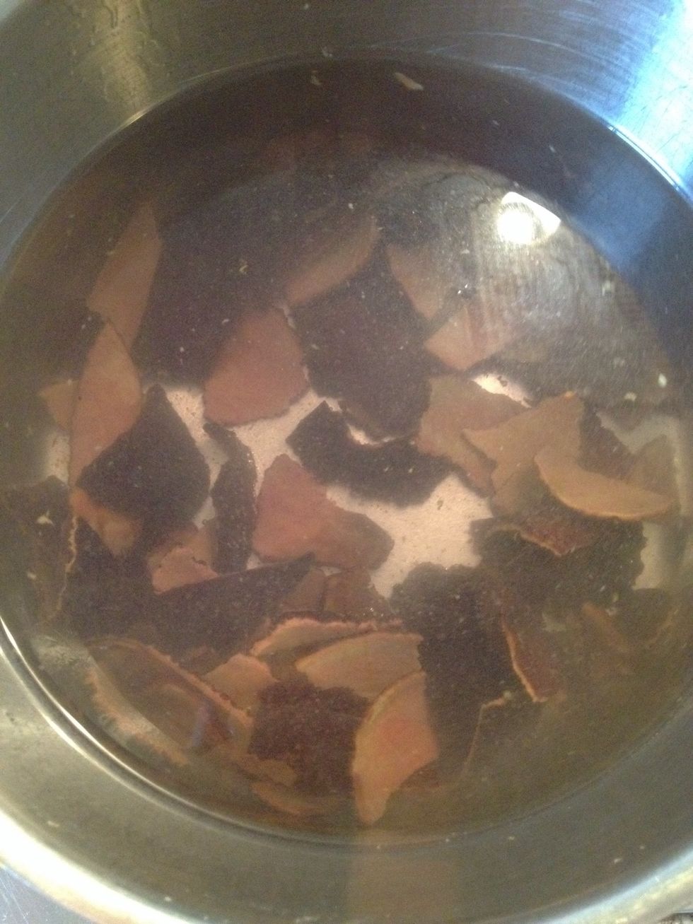 I rinsed the peel in cold water and placed it in the pot, covering it with water. I then boiled the peel for one hour with the lid on.