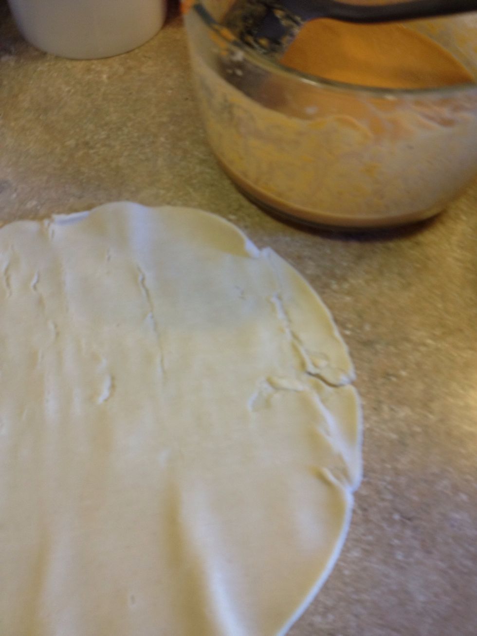 I roll out the pie crust