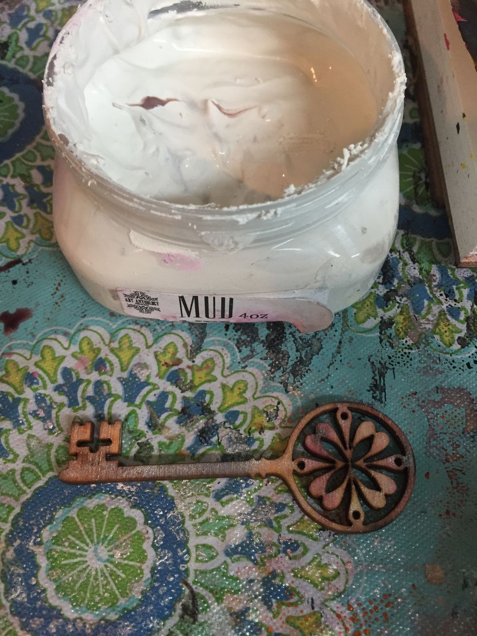 I rubbed some of Art Anthology's Mud on a wood cut out key.