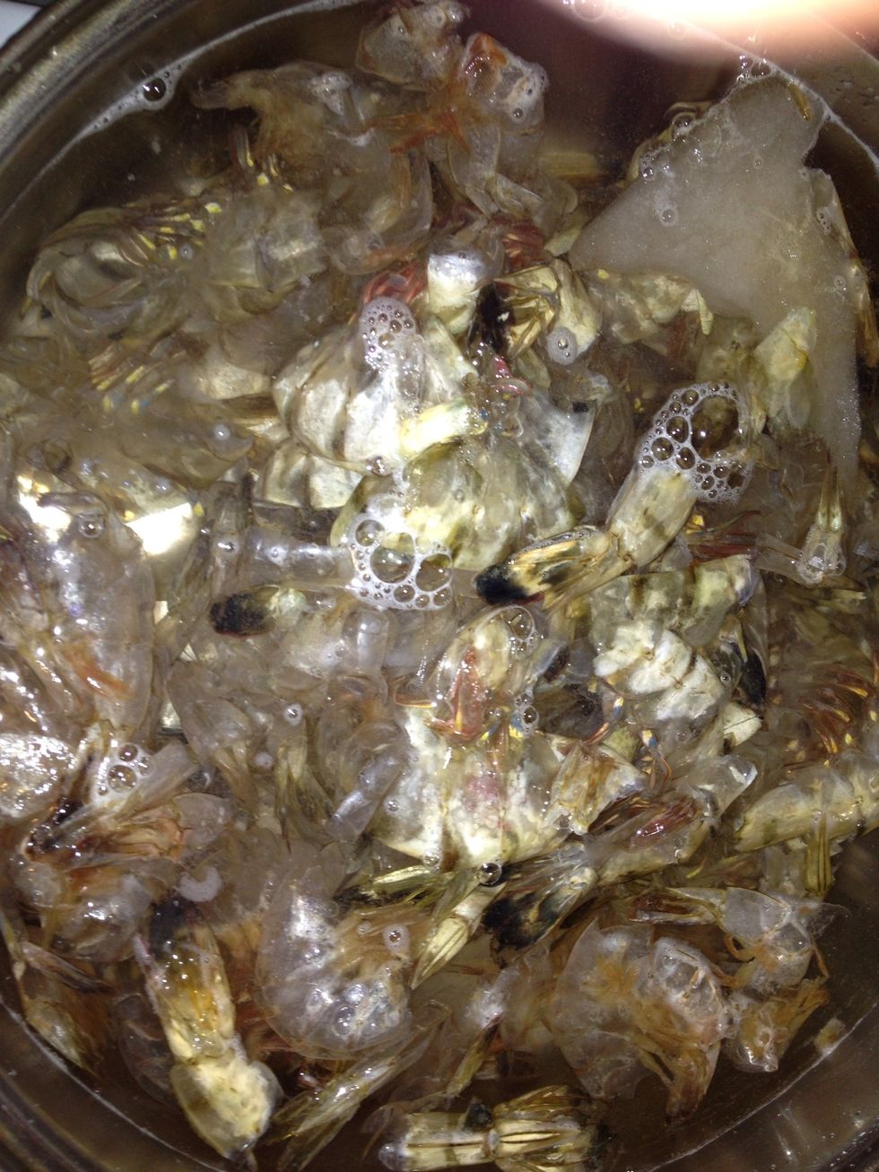 I save shrimp shells instead of throwing them away for making broth. I add the collection to a pot of water with a couple of tablespoons of shrimp boil or old bay and simmer.