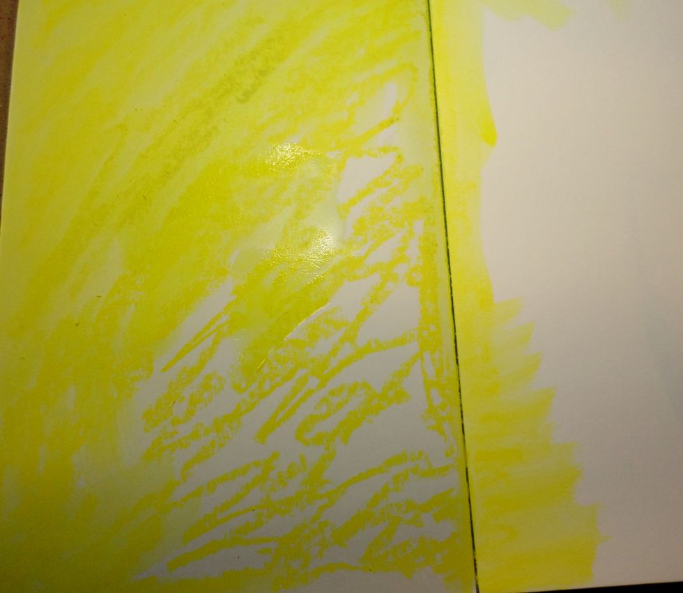 I scribbled my yellow Gelato on my pages and blended them with a paintbrush and water. This is my background. I like how the scribbling makes different levels of color when mixed with water.