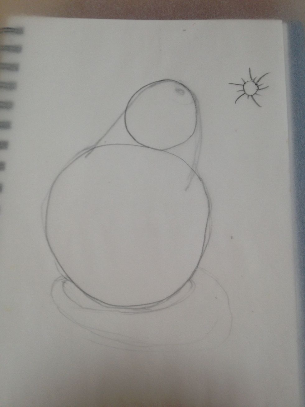 I see two spheres stacked. I could also see this as a cone, but I see spheres. My light source was a window to the right. This now looks like a simple shading exercise.