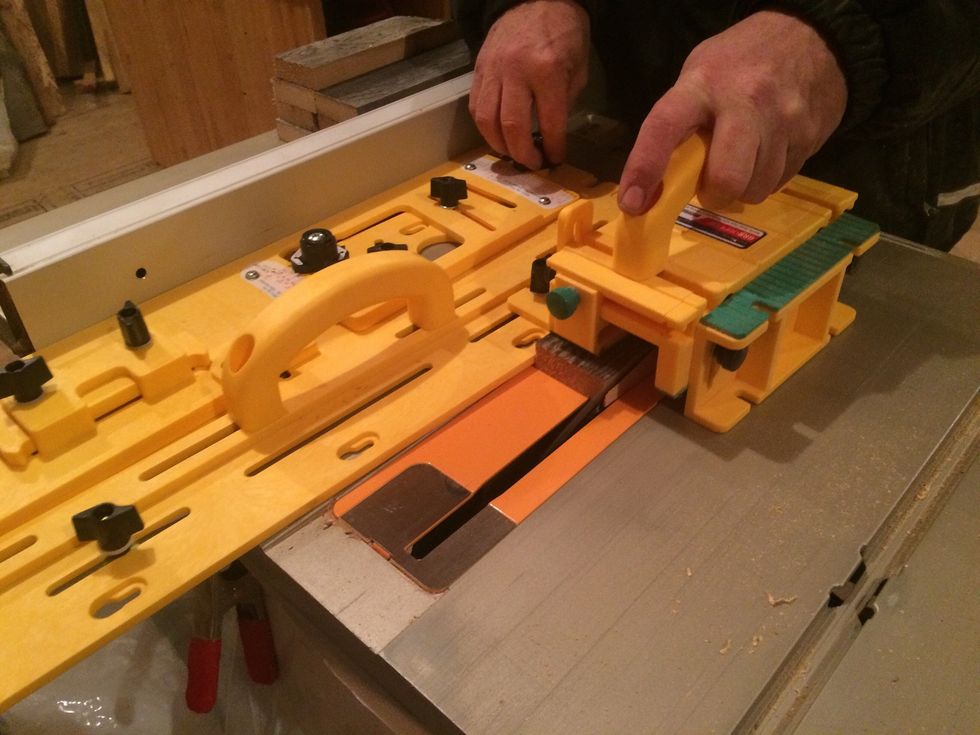 I set the piece in this taper jig to cut along my line. My saw is set at 15 degrees for the angle I need. 360* divided by 12 = 30* Since they are 2 parts to that angle I divide by 2 to get 15*.