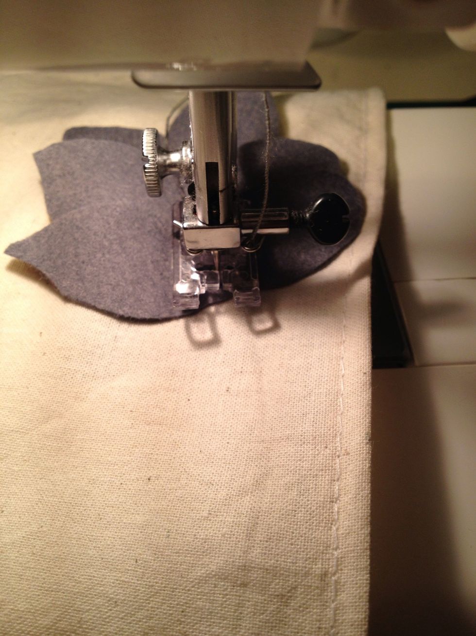 I sewed on the felt leafs two at a time following the semicircle. I used a transparent press foot so I could see where I was going.