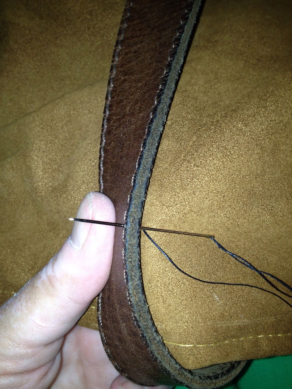 I sewed the belt on by hand, using the holes that was already there.