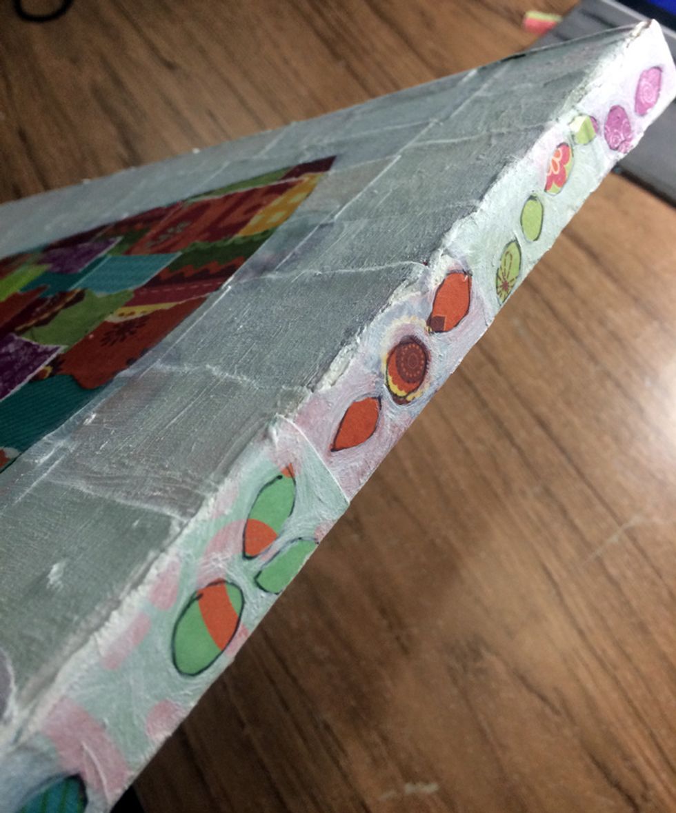 I sketched little flowers and leaves on the edges of the canvas, too, and painted gesso around them.