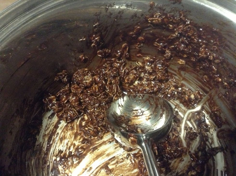 I skipped a picture but after the 3 minutes is up add the coco, oats, vanilla and stir until combined then use your scoop to place the cookies on the sheet