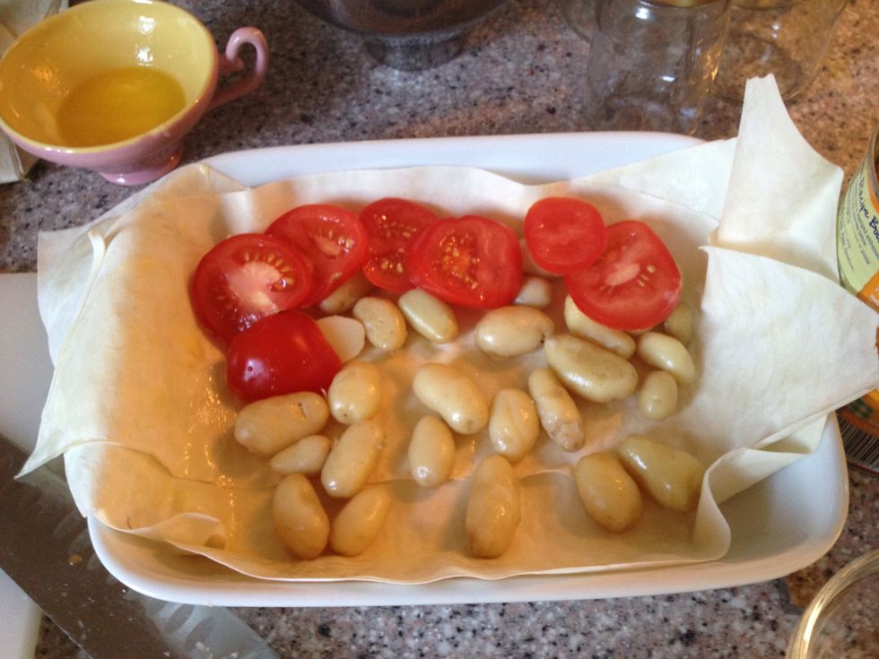 I sliced the tomatoes and placed them on top of the potatoes. This is only half of a tomato, I placed the rest after the photo opp.