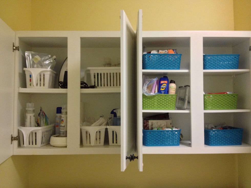 I spend a lot of time doing laundry. These cabinets are sad. To make boring white cabinets more cheery, add a simple interior color to give it more pop!