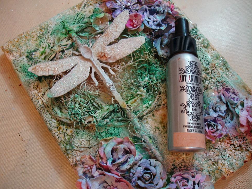 I sprayed Rustic Colorations to my canvas heat dried it with my heat tool.