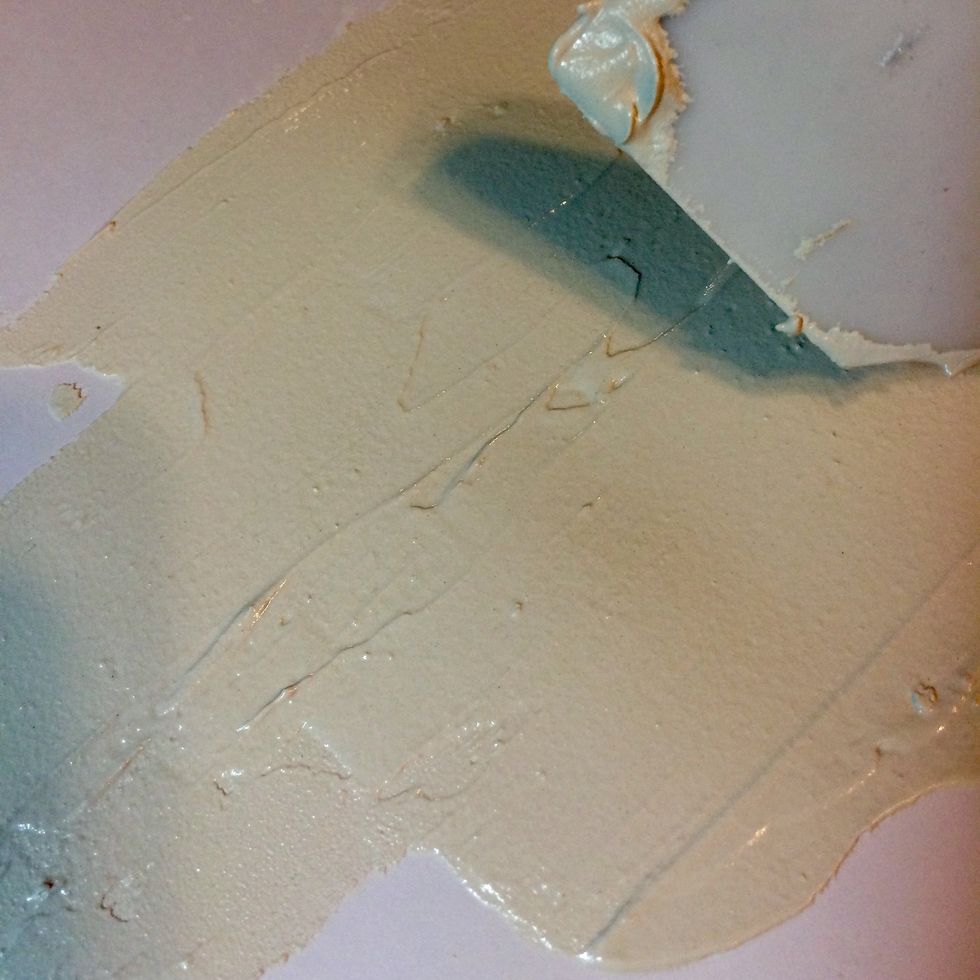 I spread the Mud Texture Medium onto the page.