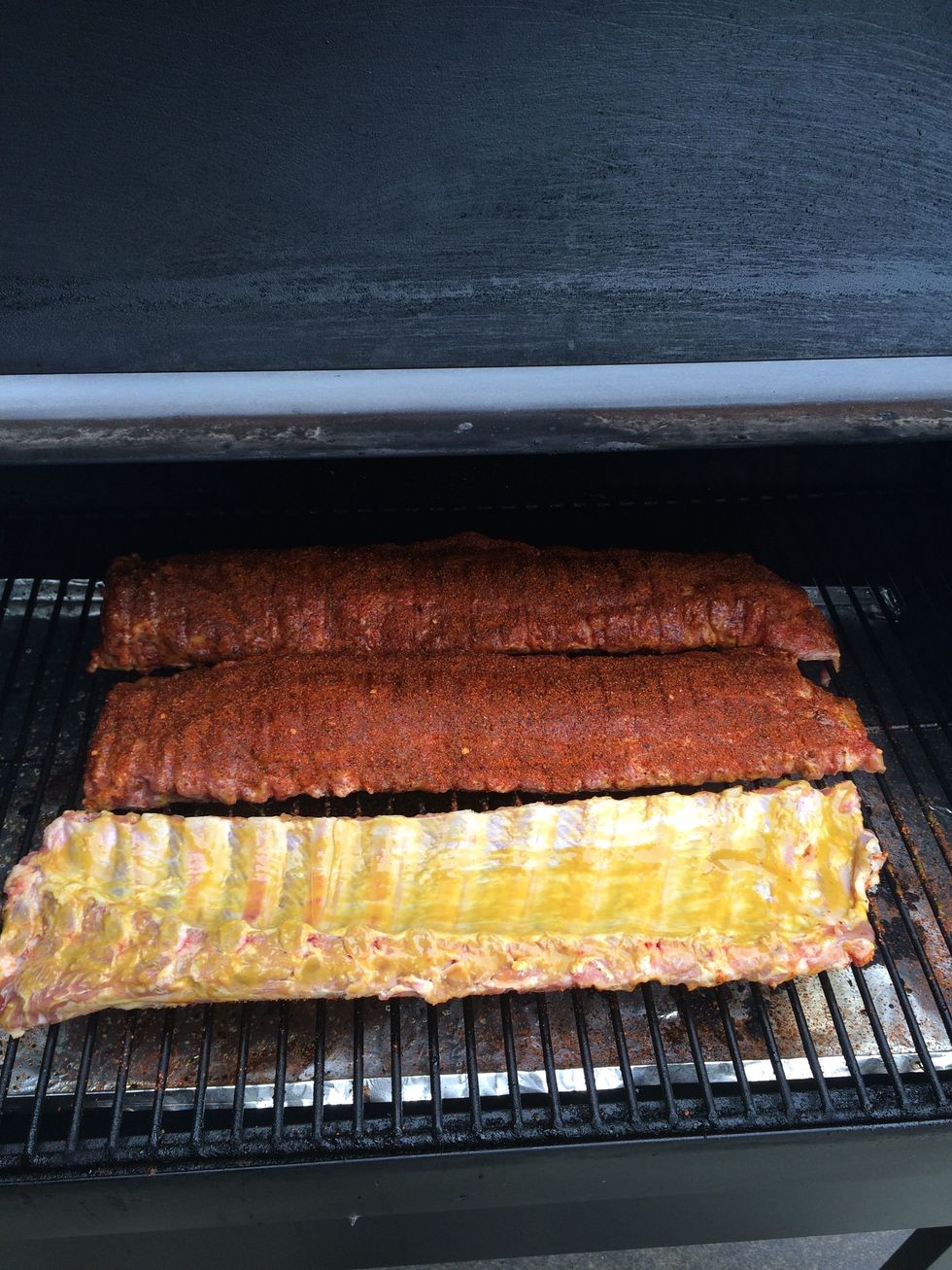 I sprinkle the rub on the bottoms of the ribs as I put them on the grate. I think the finished product looks better this way. Personal preference, of course. But do put the rub on the bottoms as well.