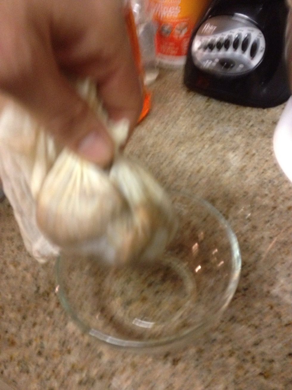 I squeezed out the pulp through a fine weave cheese cloth but you can just use you hands, just put a pod in your hand squeeze your hand into a fist and the pulp squirts through your fingers.