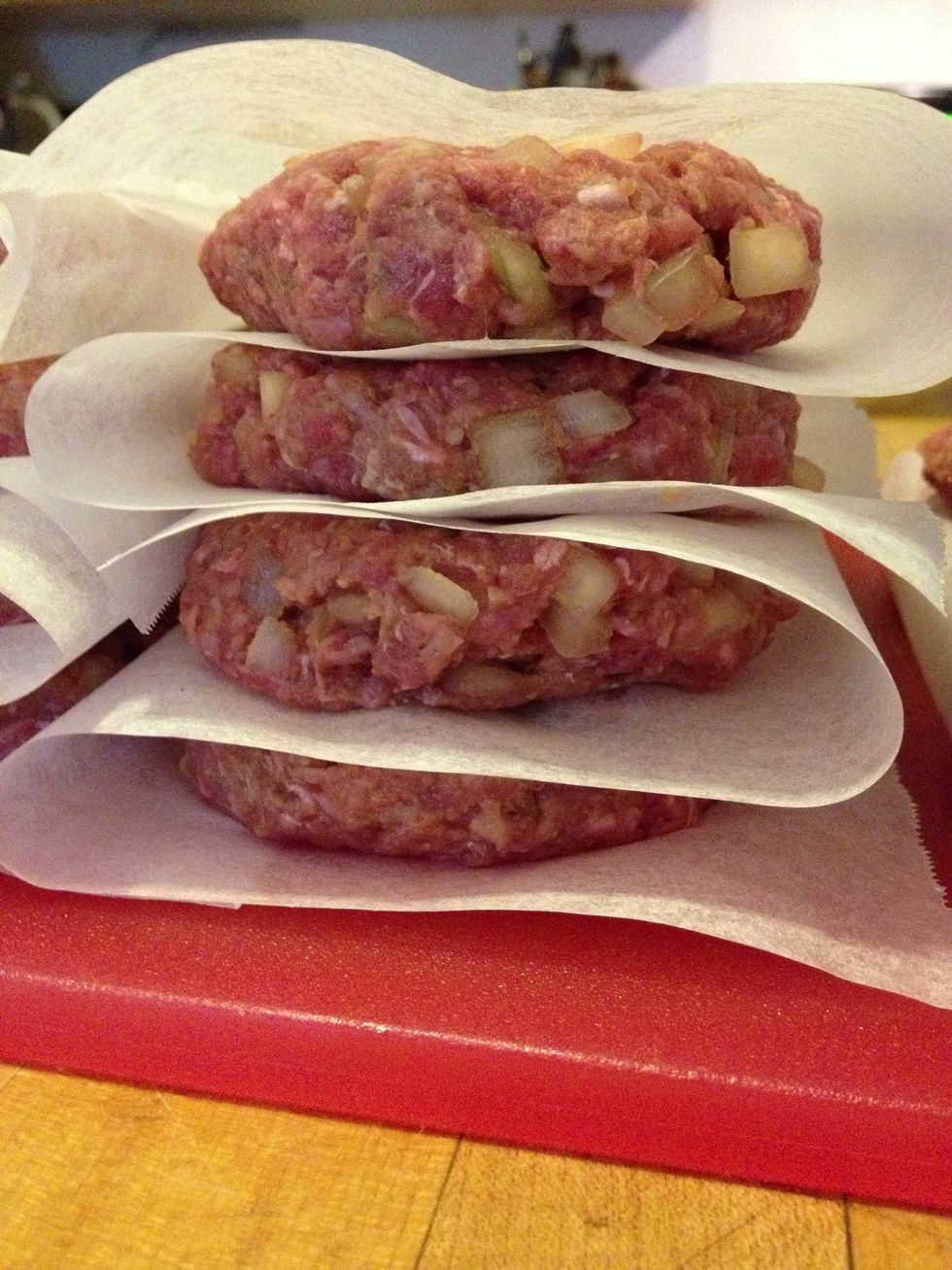 I stack the patties on parchment paper as I go. I can usually put four patties on a carefully folded piece of parchment paper. This is the side of a stack of eight.