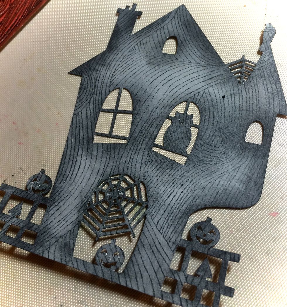 I stamped S628 Sea Waves over the house, but I turned the image 90 degrees.