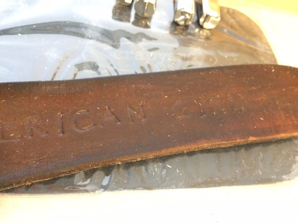I stamped the words, "American Girl" into the leather. Now, I've heard that there are these types of stamps that are meant for stamping into metal and another that are meant for stamping into leather.