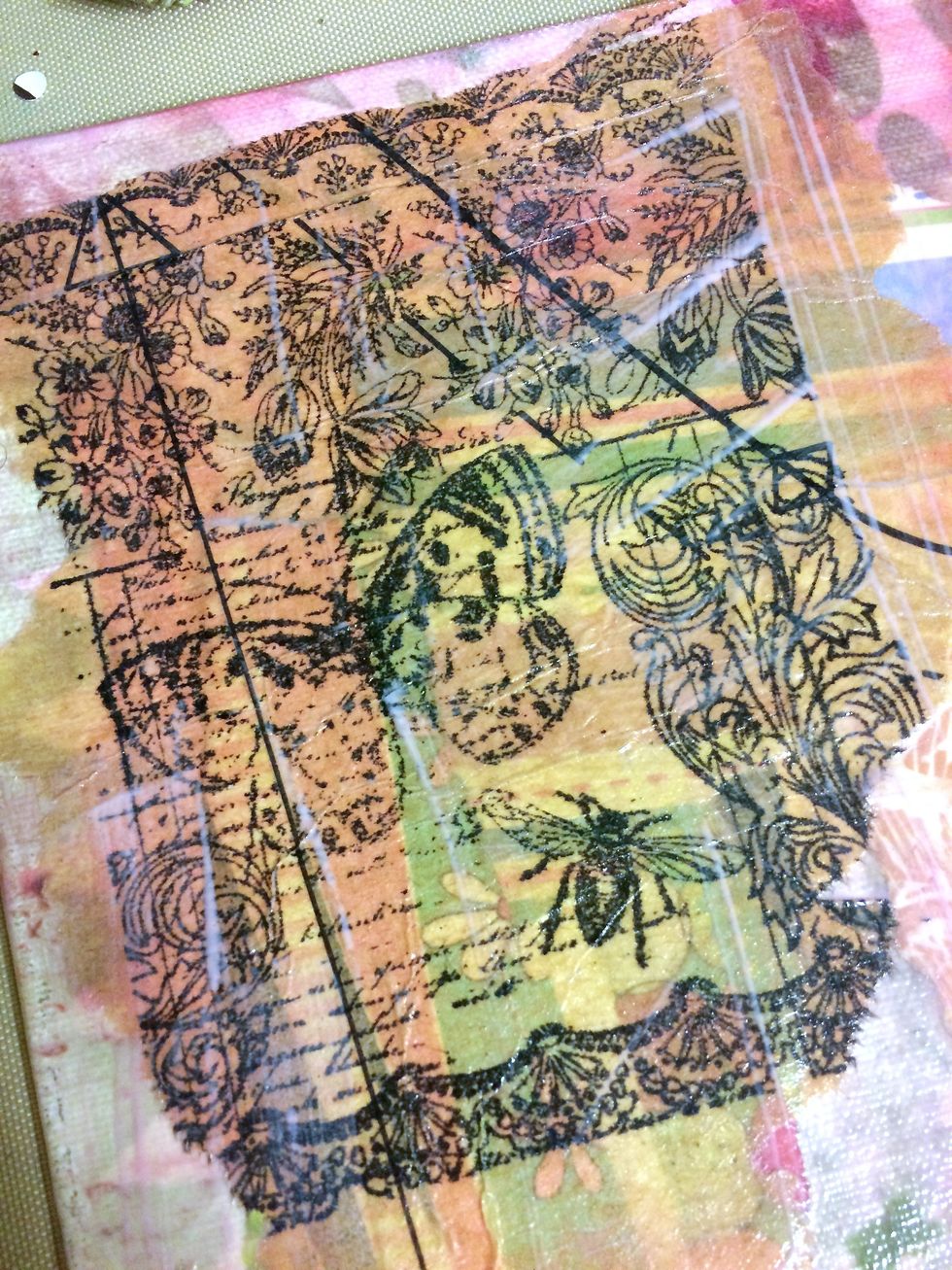I stamped this stamp from Technique Junkies onto pattern tissue paper. Literally, paper from a dress pattern. lol Then, I collaged it onto the canvas.