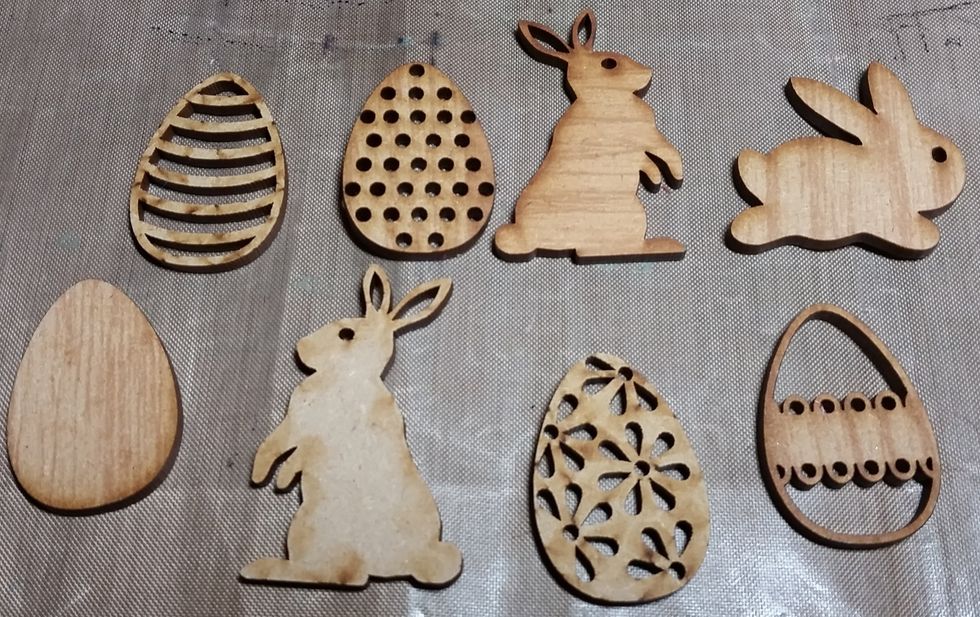 I stared with ULD wood shapes in eggs and bunnies to fit an Easter theme.