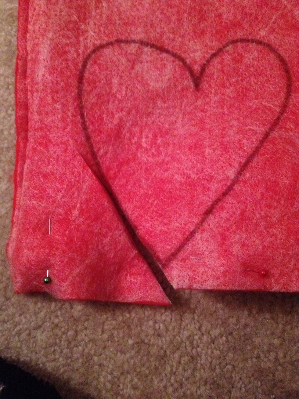 I start to cut the bottom and then start sewing from there. I normally trim the heart as I work my way around the heart sewing it.