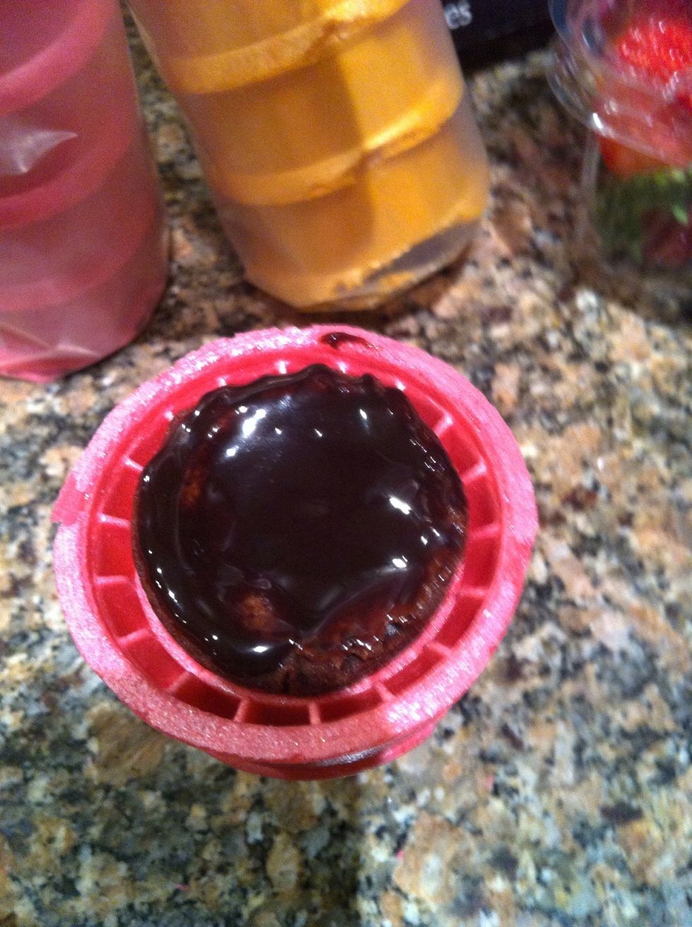 I started by dunking a brownie inside melted chocolate and placed it inside the ice cream cone. When the chocolate hardened it acted as the 'glue', keeping the cone and brownie together.