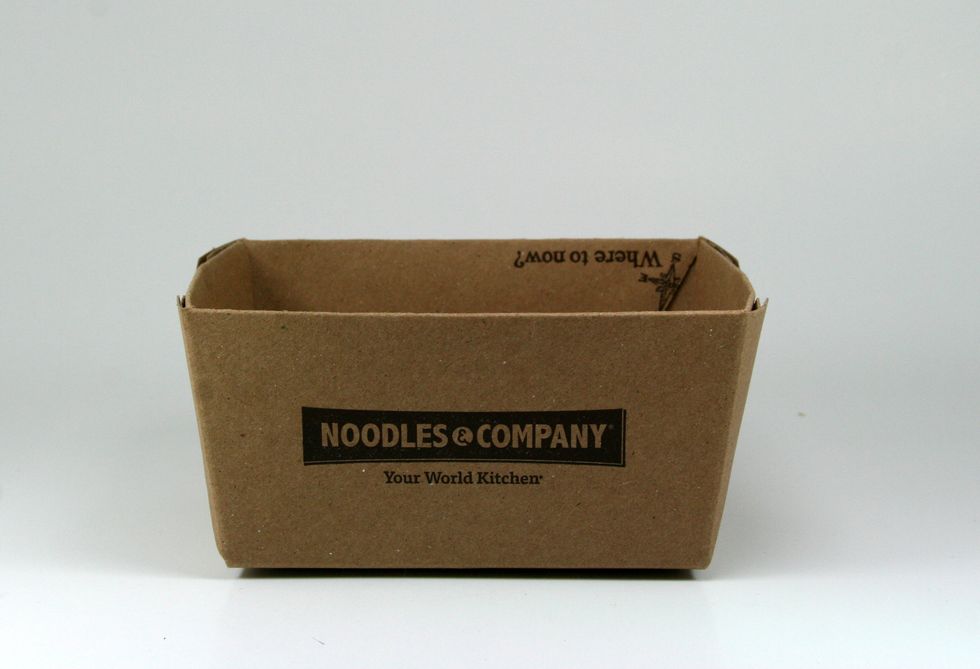 I started by folding the flaps in to see how they fit. They did need to be trimmed a bit to conform to the tapering shape of the box. Folding them in will give a much nicer finished edge.