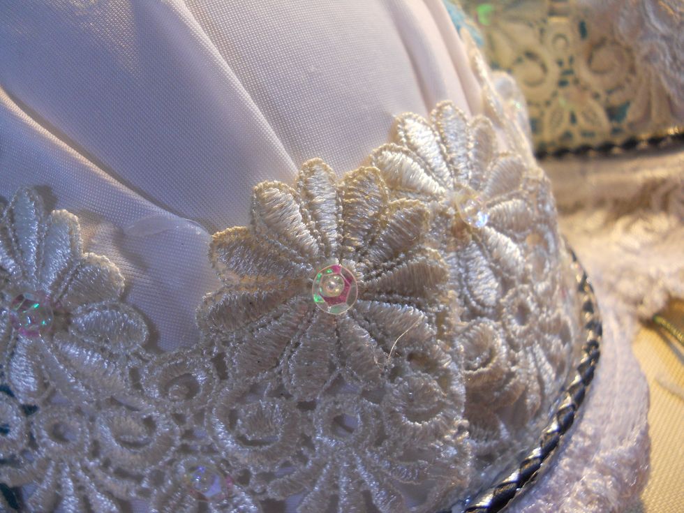 I started by using a hot glue gun to adhere some vintage lace.