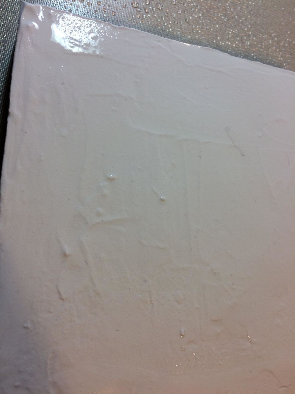 I started my canvas by applying a thick layer of mud over the entire piece, trying to make it even and level.