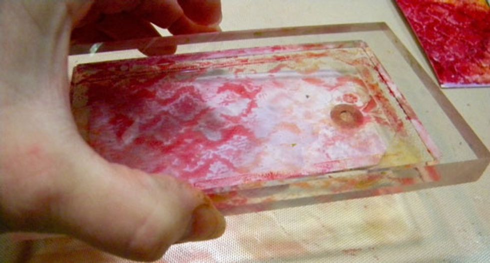 I still had some paint on it so I stamped again on the other purple tag. Clean the Gelli Plate with a baby wipe or a rag.