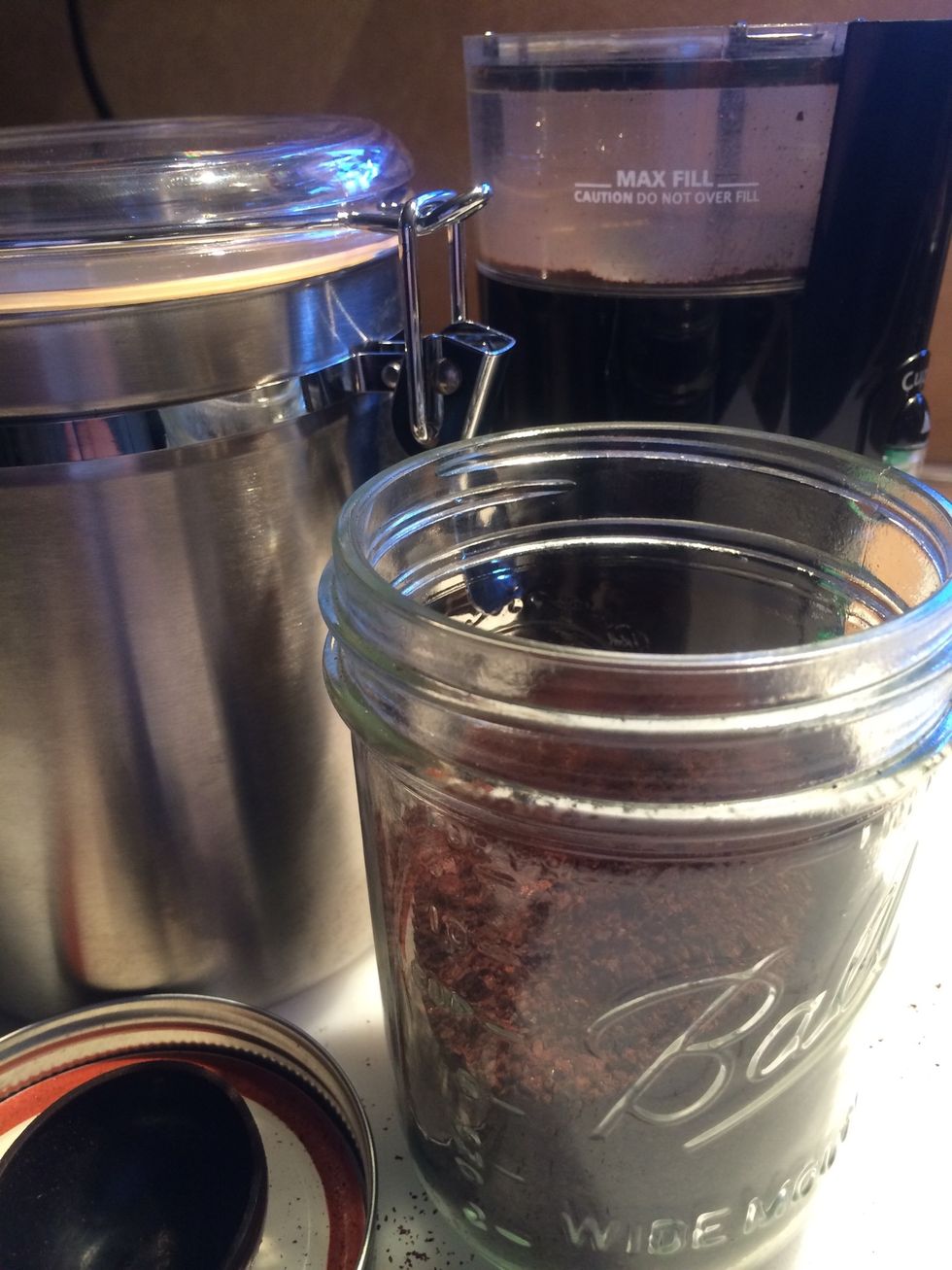 I store all unused ground coffee beans in ball jars and keep them in the cabinet.