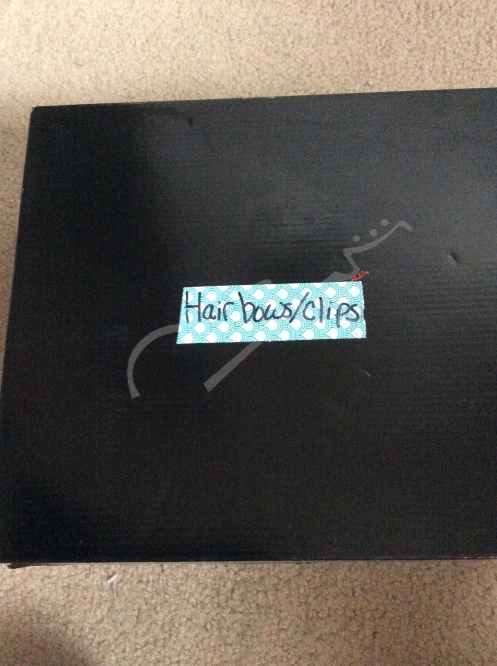 I store my collection in a shoe box and I put some decorative duct tape over the logo :)