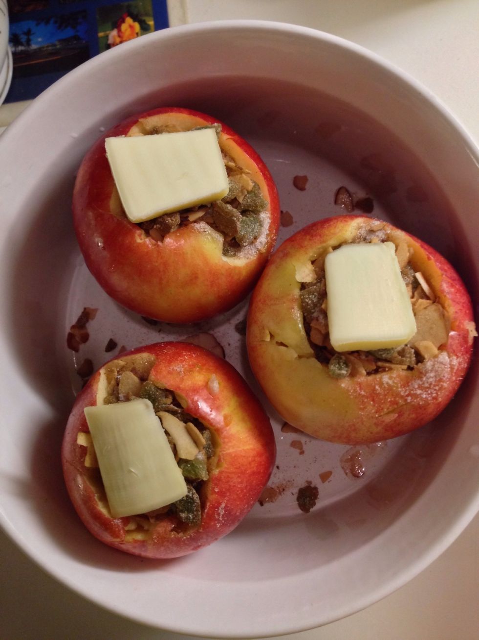 I stuffed the apples with the dry mixture and added a thin slice of butter atop. Then I poured 3/4 cup of boiling water into the baking pan before putting the apples in the oven for 30 minutes.