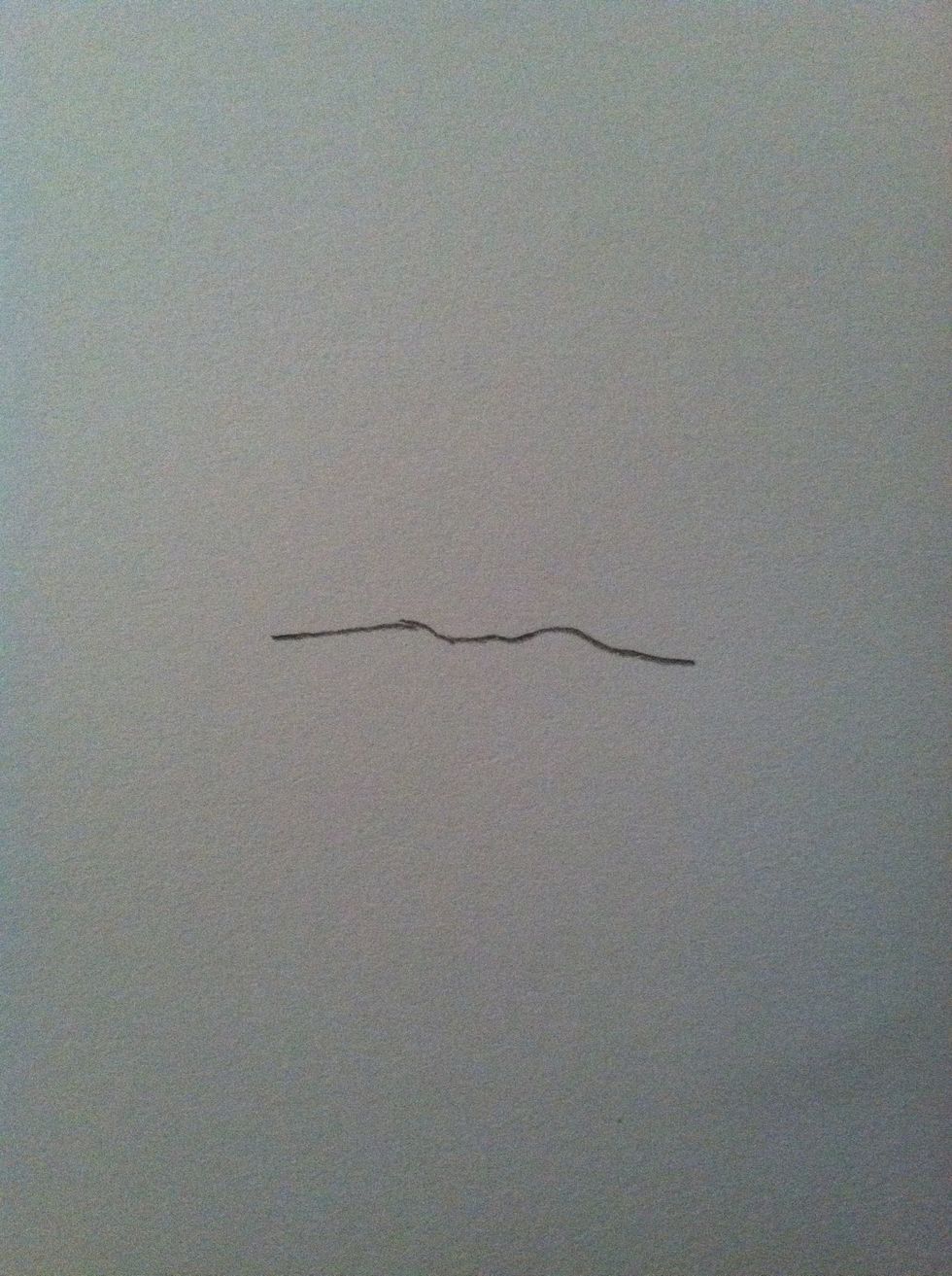 I suggest beginning by drawing the center line since this is the darkest part of your lips. It will not, and should not, be perfect.