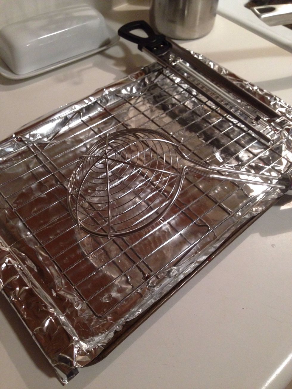 I take a baking pan, cover it in aluminum foil, and use a rack to help drain the oil. This one wasn't the best rack (the chips kept falling through), but it does the job.