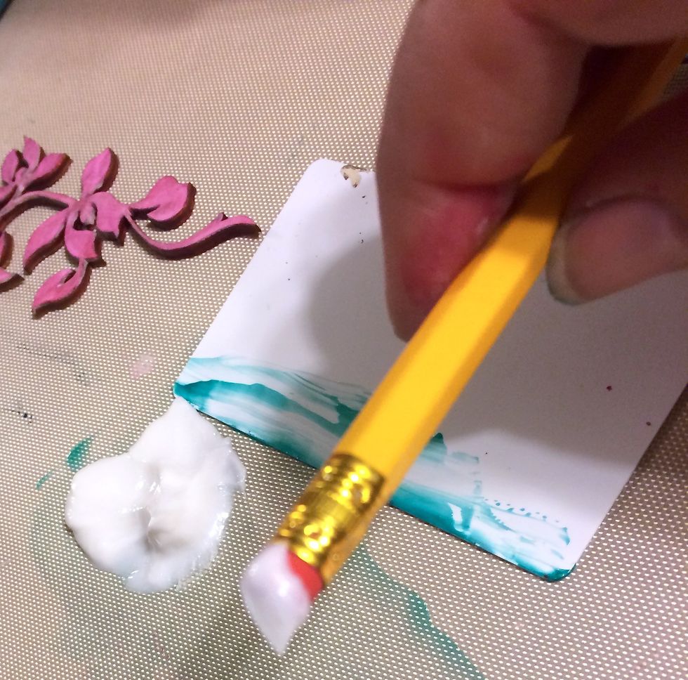 I take the eraser end of a pencil and dip it into Frost Clear Coats.
