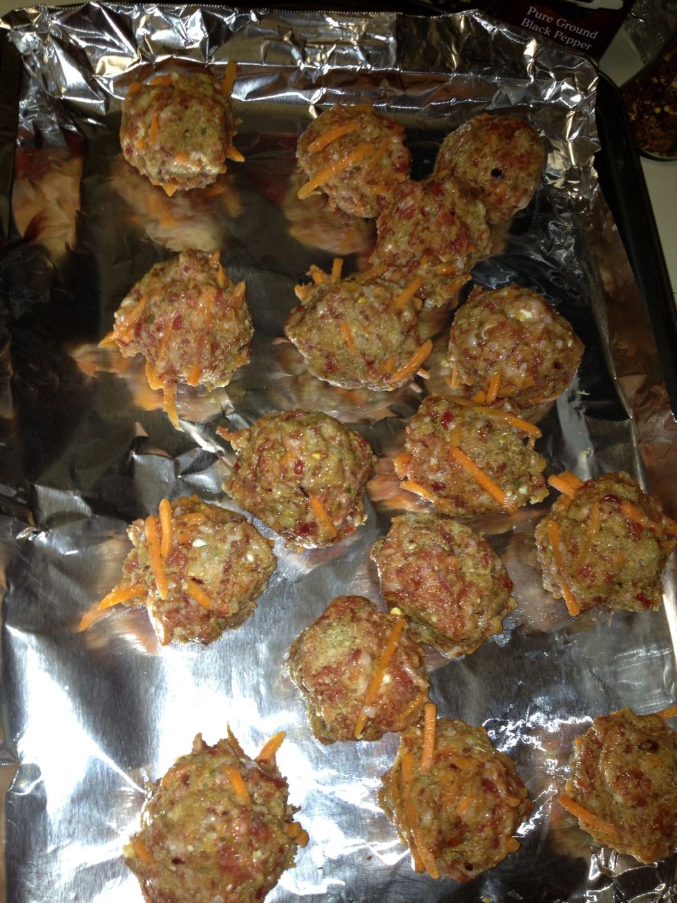 I take the packaged Italian sausage add half cup shredded carrots 1 1/2 bread crumbs all dry seasonings and two eggs make meatballs. Bake at 350 degrees for 35 min