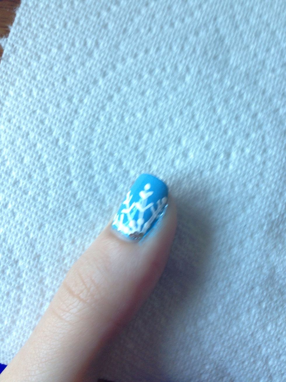 I then added four pieces of glitter by dipping a toothpick onto the brush and picking up the large pieces