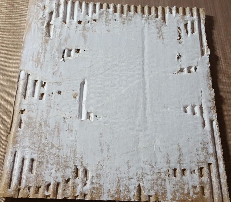 I then added heavy white gesso sparingly in some areas and heavier in others leaving parts of the corrugate bare. Once dry I went over entire area with clear gesso.