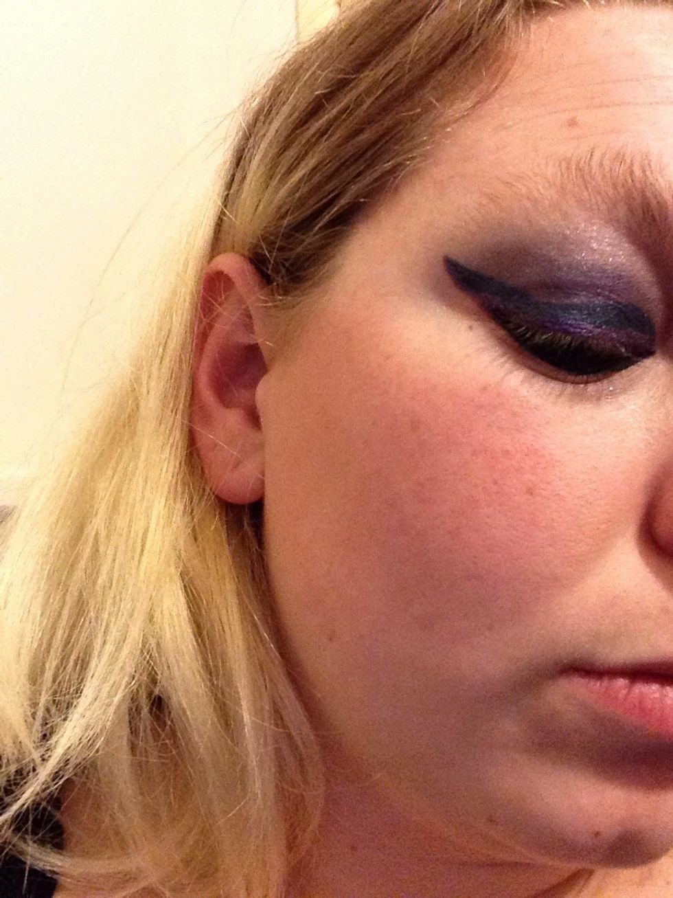 I then applied a darker grey colour but dark beige/mid blue can also be used in the crease of the eye. After this you would usually apply the dark blue/purple/black on the rest of the lower lid.