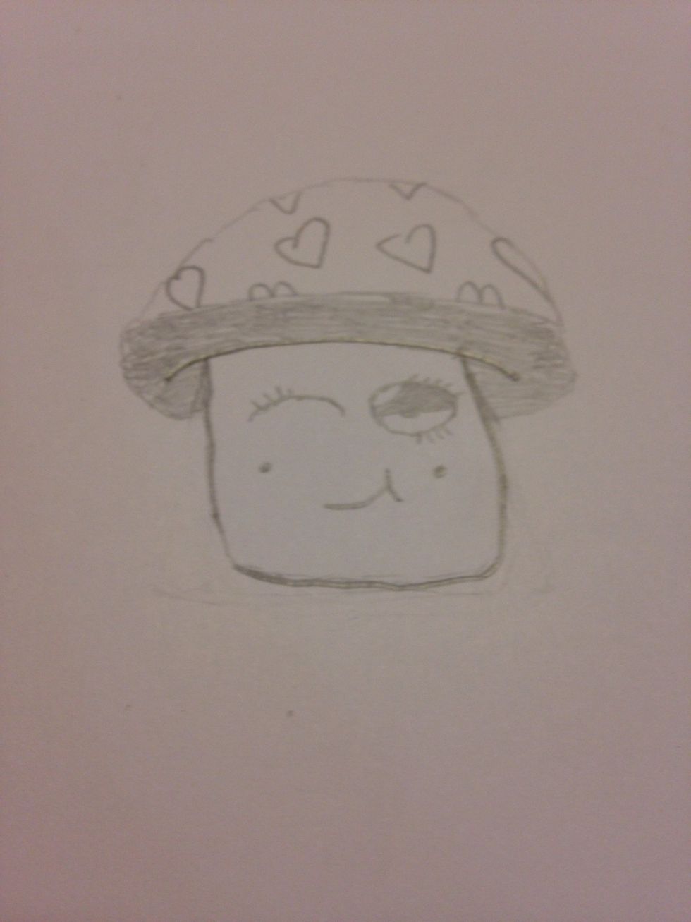 I then finished the eyes and added a mouth along with some little dots to represent the cheeks