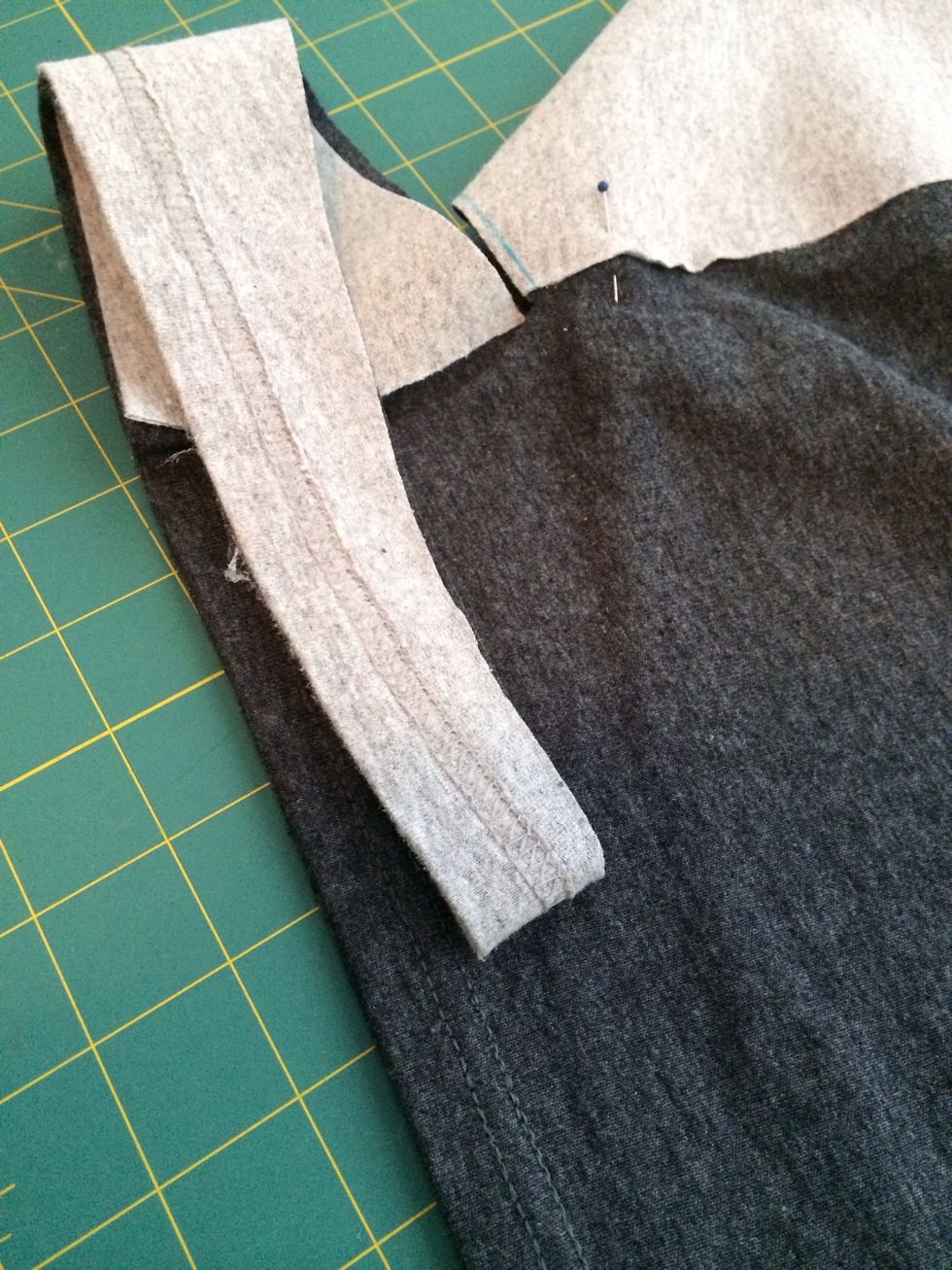 I then folded the back in half and used the piece I just cut from the front as a template for the back curve.