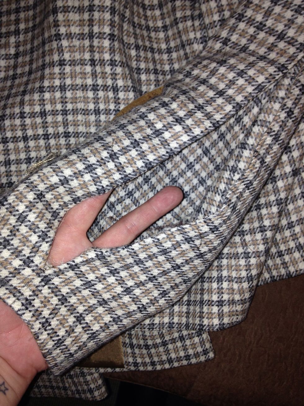 I then opened the sleeve stopping before the cuff and the armpit . The sleeve should open out plenty wide enough to lay the patch flat for stitching.