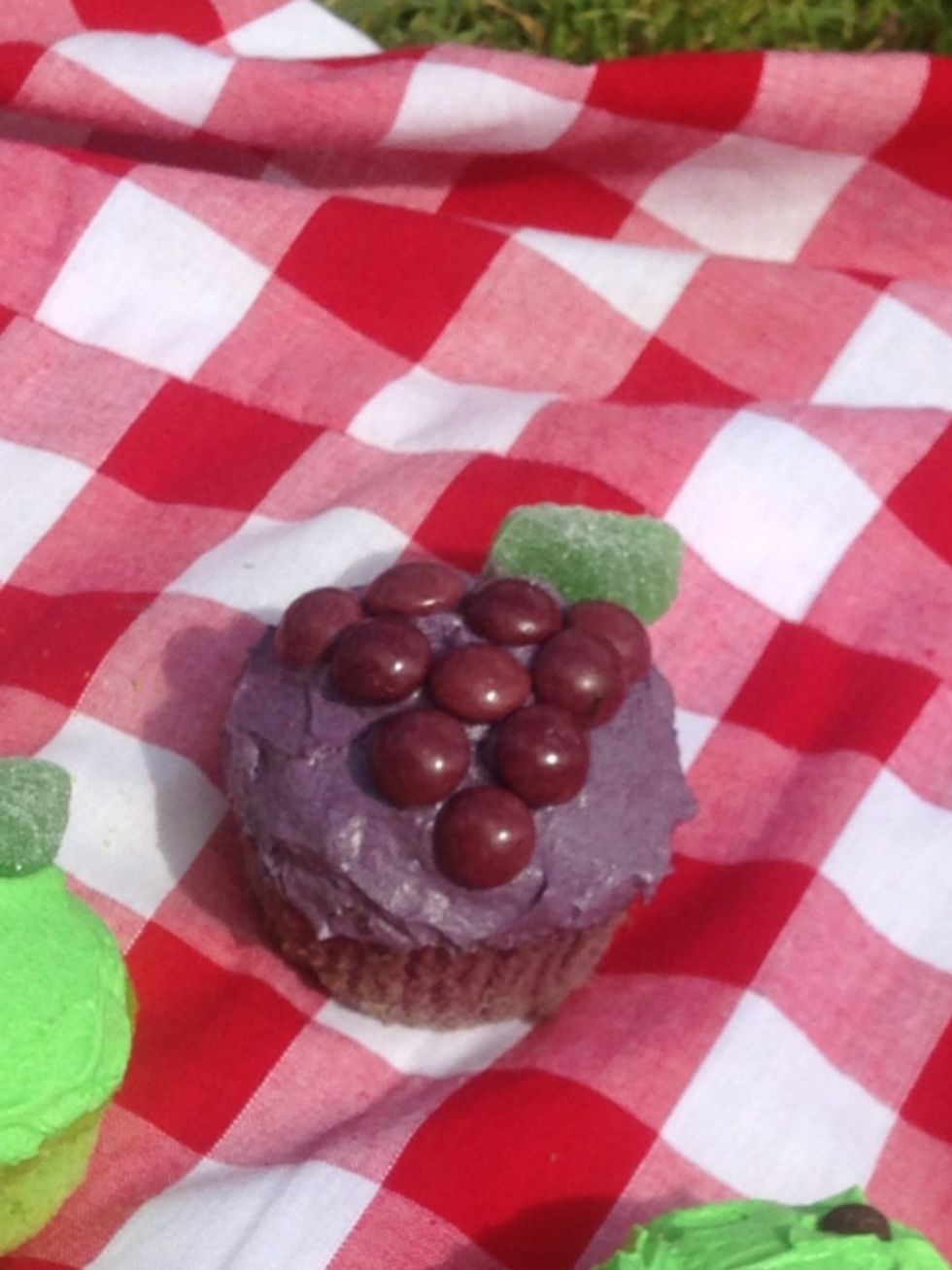 I then put purple skittles in a triangle formation to look like a bunch of grapes, finishing off with a spearmint leaf.