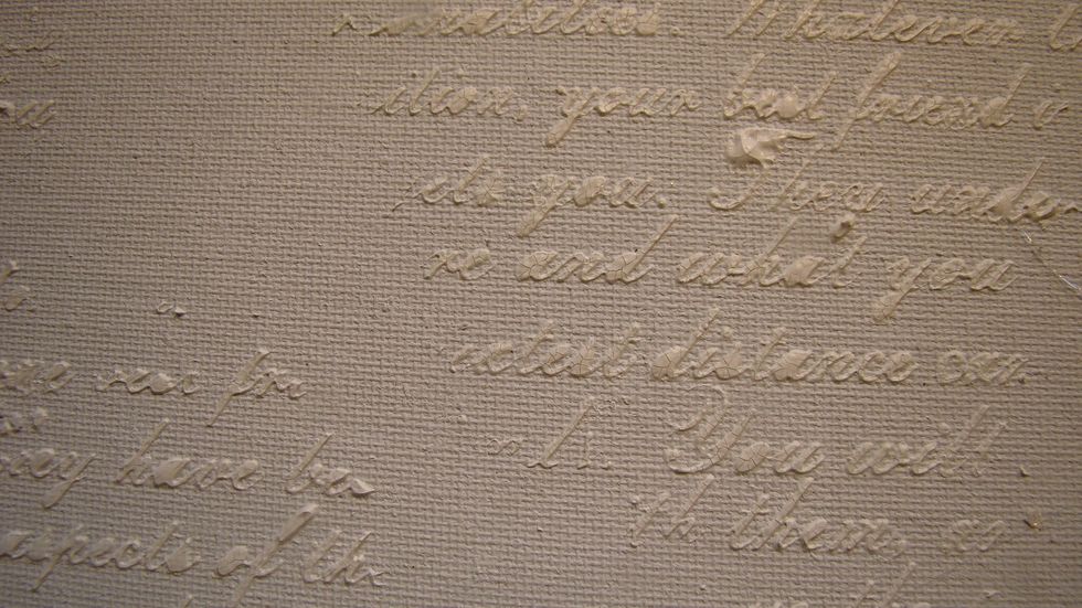I then randomly added this script stencil to my canvas as well and allowed to dry.