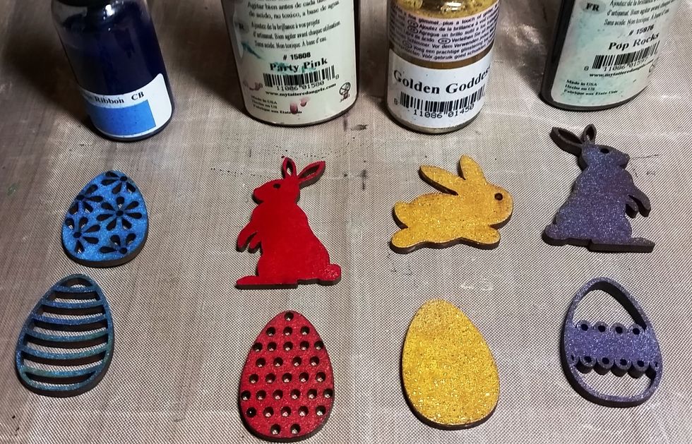 I then spray or painted each wood item in TA Party Pink, Golden Goddess, Blue Ribbon, and Pop Rocks to fit with the Easter bright colors. Let dry Completely.