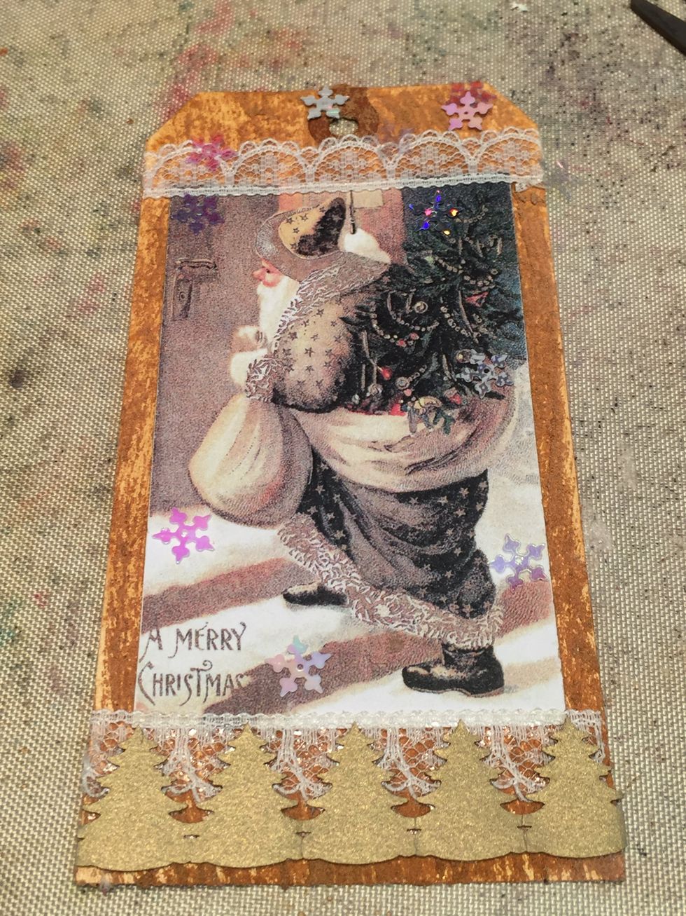 I then trimmed the bottom with some Christmas tree border I had and sprinkled snowflake confetti over the page.