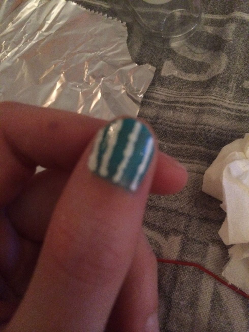 I then used a paper clip to dab white nail varnish onto my nails. I did three or four lines on each nail.